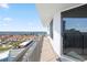 Balcony with metal railings offering city and ocean views, accessible via sliding glass door at 2555 S Atlantic Ave # 1007, Daytona Beach Shores, FL 32118