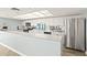 Modern white kitchen with stainless steel appliances and ample counter space at 2555 S Atlantic Ave # 1007, Daytona Beach Shores, FL 32118