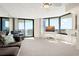 Bright living room with ocean views, comfortable seating, and a balcony access at 2555 S Atlantic Ave # 1007, Daytona Beach Shores, FL 32118