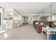Bright living room with an open floorplan, ceiling fan, and bar seating area at 2555 S Atlantic Ave # 1007, Daytona Beach Shores, FL 32118