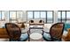Bright living room with wicker furniture and ocean views through large glass windows at 2555 S Atlantic Ave # 1007, Daytona Beach Shores, FL 32118