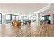 Spacious living room with wood floors and wicker seating, offering beautiful ocean views at 2555 S Atlantic Ave # 1007, Daytona Beach Shores, FL 32118