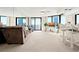 Bright living room with floor-to-ceiling windows and access to the oceanfront balcony at 2555 S Atlantic Ave # 1007, Daytona Beach Shores, FL 32118