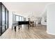 Expansive living space with a piano and an open-concept kitchen and dining area at 2555 S Atlantic Ave # 1007, Daytona Beach Shores, FL 32118