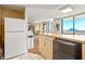 Lounge area with a refrigerator, seating, and large windows providing outside view at 2555 S Atlantic Ave # 1007, Daytona Beach Shores, FL 32118