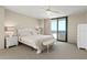 Comfortable main bedroom with beach view balcony access, ceiling fan, and white accents at 2555 S Atlantic Ave # 1007, Daytona Beach Shores, FL 32118