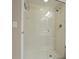Walk in shower with clear glass door, white tile and chrome fixtures at 2555 S Atlantic Ave # 1007, Daytona Beach Shores, FL 32118