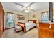 Charming bedroom features a ceiling fan, bright windows and neutral walls at 2557 Shiprock Ct, Deltona, FL 32738