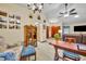 Inviting dining area featuring a wood table with seating and views of the living room at 2557 Shiprock Ct, Deltona, FL 32738