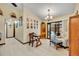 Bright dining area with sliding glass doors, dining set and access to kitchen at 2557 Shiprock Ct, Deltona, FL 32738