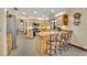 Kitchen area with stainless steel appliances, wood cabinets, and an island with bar seating at 2557 Shiprock Ct, Deltona, FL 32738