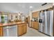 Spacious kitchen with stainless steel appliances and an eat-in dining area at 2557 Shiprock Ct, Deltona, FL 32738