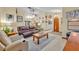 Open floor plan featuring living and dining areas, light woodgrain floors, and neutral paint at 2557 Shiprock Ct, Deltona, FL 32738
