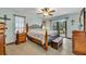 Serene main bedroom with natural light, wood floors, and access to the outdoor patio at 2557 Shiprock Ct, Deltona, FL 32738