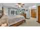 Comfortable main bedroom with wood floors, natural light, and closet at 2557 Shiprock Ct, Deltona, FL 32738