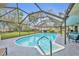 Screened-in pool features an attached spa and a ladder for easy access at 2557 Shiprock Ct, Deltona, FL 32738