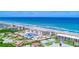Aerial view showcasing oceanfront condos, beach access, and the beautiful coastline at 2700 Ocean Shore Blvd # 305, Ormond Beach, FL 32176