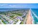 Panoramic aerial shot captures condo buildings, the coast, beaches and inter-coastal of this coastal community at 2700 Ocean Shore Blvd # 305, Ormond Beach, FL 32176