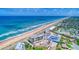 Breathtaking aerial view of oceanfront condo community and sandy beaches along the coast at 2700 Ocean Shore Blvd # 305, Ormond Beach, FL 32176