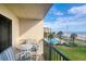 Relax on this balcony with a view of the pool, ocean, and community in a beachfront condo at 2700 Ocean Shore Blvd # 305, Ormond Beach, FL 32176