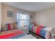 Inviting bedroom with twin beds, soft lighting, and a pleasant, relaxing atmosphere at 2700 Ocean Shore Blvd # 305, Ormond Beach, FL 32176