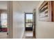 Inviting entryway featuring wood floors and a view of the balcony's outdoor scenery at 2700 Ocean Shore Blvd # 305, Ormond Beach, FL 32176