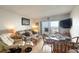 Inviting living room with comfortable seating, dining area, and balcony access with ocean views at 2700 Ocean Shore Blvd # 305, Ormond Beach, FL 32176