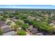 Expansive aerial view showcasing a peaceful neighborhood with lush greenery, serene lakes, and well-maintained homes under a sunny sky at 2859 Doe Run Trl, Orange City, FL 32763