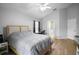 Bright bedroom features wood-look floors and ensuite bathroom at 2859 Doe Run Trl, Orange City, FL 32763