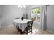 Bright dining area with a large window and neutral decor at 2859 Doe Run Trl, Orange City, FL 32763