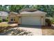 Charming single-story home featuring an attached two-car garage, well-maintained landscaping, and a concrete driveway at 2859 Doe Run Trl, Orange City, FL 32763