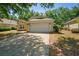 Charming single-story home featuring an attached two-car garage, well-maintained landscaping, and a concrete driveway at 2859 Doe Run Trl, Orange City, FL 32763