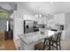 Bright kitchen featuring stainless steel appliances, a marble island, and modern lighting at 2859 Doe Run Trl, Orange City, FL 32763