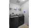 Efficient laundry room features new washer and dryer units, providing convenience for laundry tasks at 2859 Doe Run Trl, Orange City, FL 32763