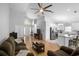 Open-concept living room flows to kitchen, perfect for entertaining Gathering and friends at 2859 Doe Run Trl, Orange City, FL 32763