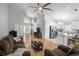Open-concept living room flows to kitchen, perfect for entertaining Gathering and friends at 2859 Doe Run Trl, Orange City, FL 32763