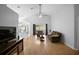 Spacious living room with vaulted ceiling, ceiling fan and slider to backyard at 2859 Doe Run Trl, Orange City, FL 32763