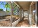 Enclosed patio offers a serene spot with backyard views, providing a private outdoor space at 2859 Doe Run Trl, Orange City, FL 32763