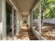 Enclosed patio offers a serene spot with backyard views, providing a private outdoor space at 2859 Doe Run Trl, Orange City, FL 32763