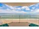 Balcony view overlooking the ocean, beach, and cloudy blue sky at 2967 S Atlantic Ave # 604, Daytona Beach, FL 32118