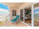 Balcony with chair, ocean view, and living room entry at 2967 S Atlantic Ave # 604, Daytona Beach, FL 32118