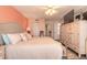 Bedroom with large bed, closet, and dresser at 2967 S Atlantic Ave # 604, Daytona Beach, FL 32118