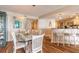 Dining area showcasing a glass table and seating for six, adjacent to the kitchen at 2967 S Atlantic Ave # 604, Daytona Beach, FL 32118