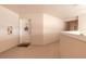 Hallway with a welcoming door and nautical star decor, leading to unit at 2967 S Atlantic Ave # 604, Daytona Beach, FL 32118