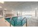 Indoor swimming pool with bright lighting and large glass windows overlooking the ocean at 2967 S Atlantic Ave # 604, Daytona Beach, FL 32118