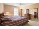 Bedroom featuring carpet floors, a ceiling fan, and bright natural light at 3021 Little Cypress Cv, Winter Park, FL 32792