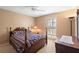 Bedroom featuring carpet floors, a ceiling fan, and bright natural light at 3021 Little Cypress Cv, Winter Park, FL 32792