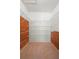 Spacious walk-in closet with ample shelving for organized storage and cedar paneling at 3021 Little Cypress Cv, Winter Park, FL 32792