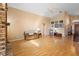 Comfortable living room with hardwood floors, a cozy couch, and natural lighting at 3021 Little Cypress Cv, Winter Park, FL 32792