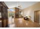 Spacious living room featuring vaulted ceilings and a brick fireplace at 3021 Little Cypress Cv, Winter Park, FL 32792